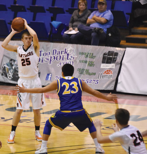 Garrick Hodge/MDN  Rugby's Cade Heilman (25) surveys the passing lanes during a high school basketball game on Thursday at the MSU Dome. Beulah defeated Rugby 62-50.  